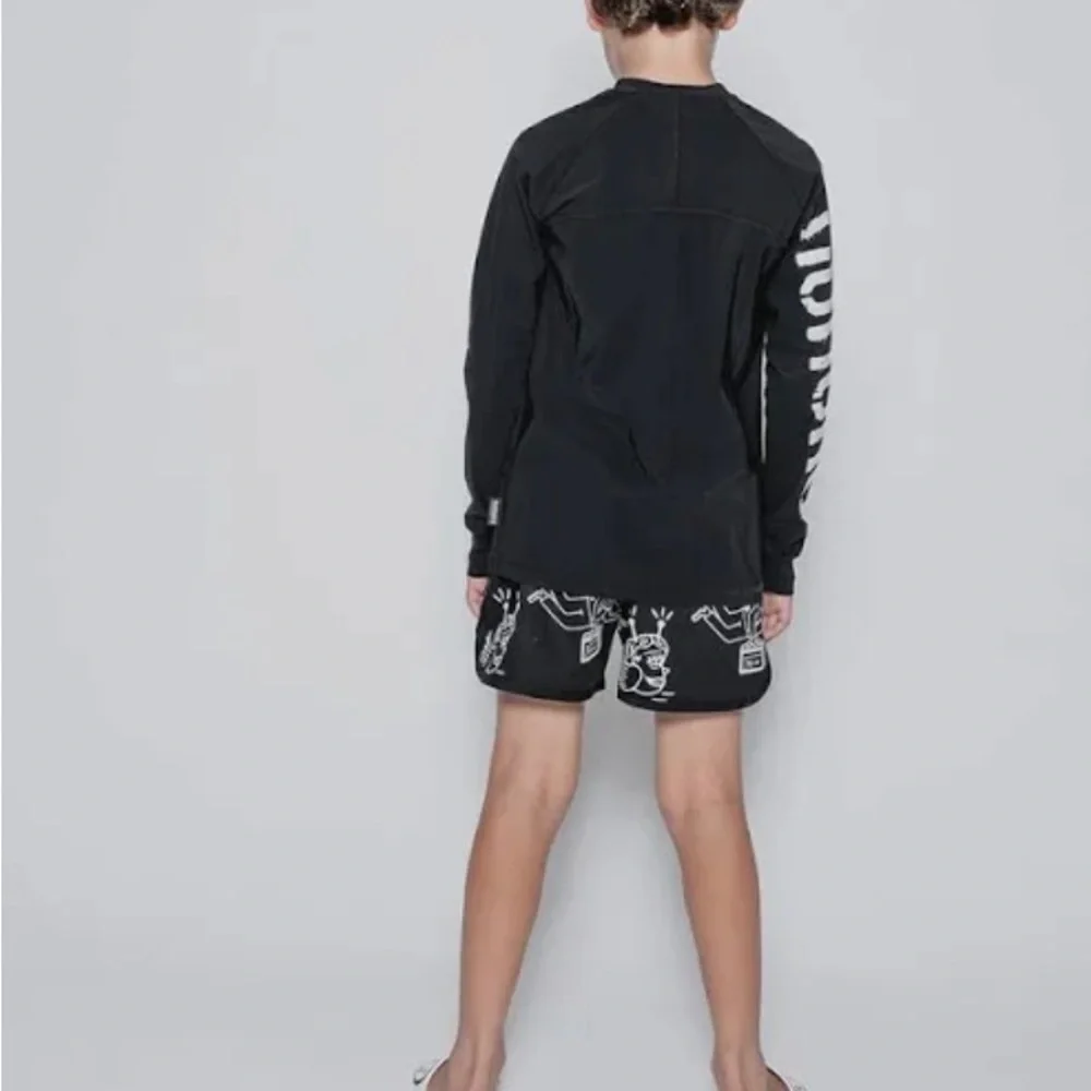 Black Long Sleeve Shirt with White Lettering by Nununu